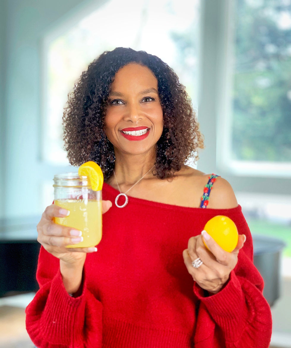 Miniatura: Woman wearing bra with flower straps holding cup of lemonade. Blue floral bra straps worn with red off the shoulder top.