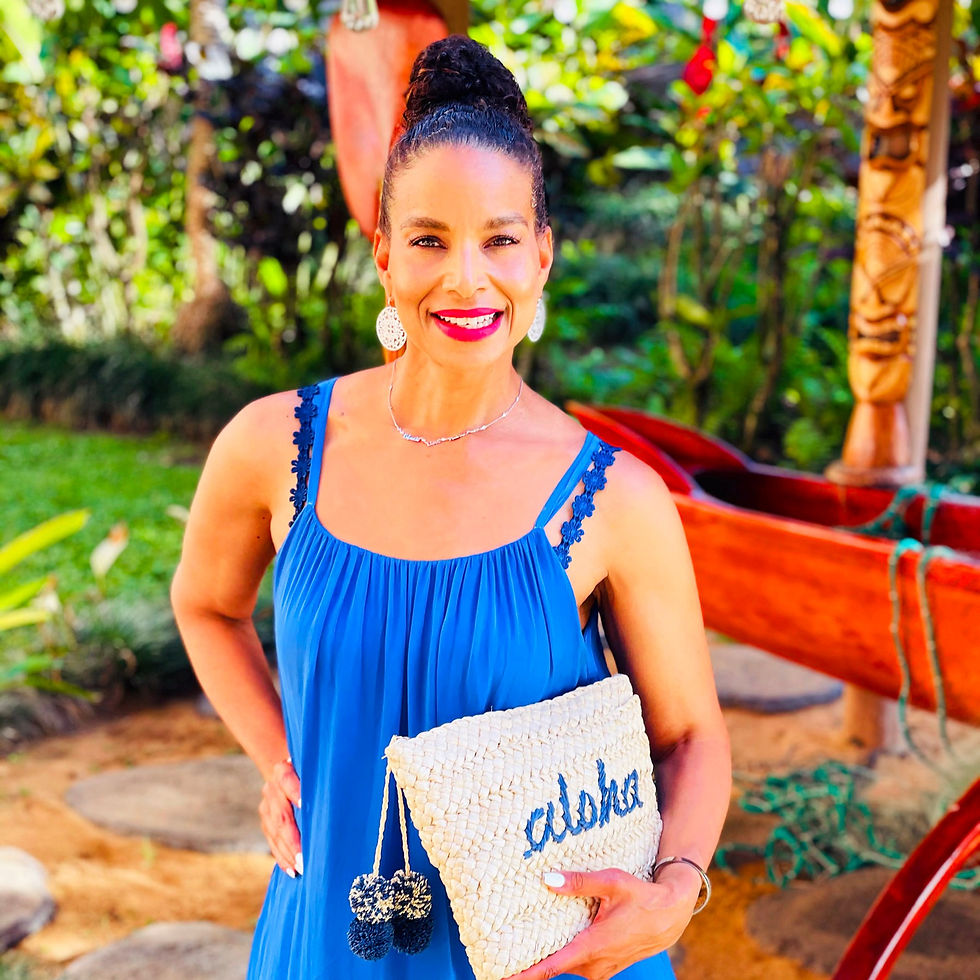 Miniature : Woman wearing bra with flower straps featuring blue daisy floral details, in blue tank top, holding purse.