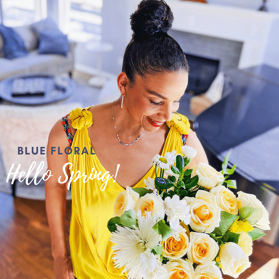 Miniatura: Woman wearing bra with flower straps in front of bouquet. Blue floral decorative bra straps worn with yellow tank top.