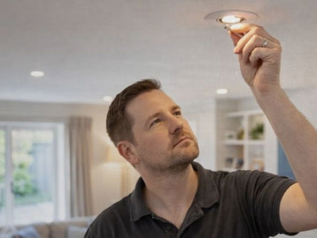 Professional electrician working carefully in a residential home, helping ensure electrical safety and a sense of comfort for homeowners.