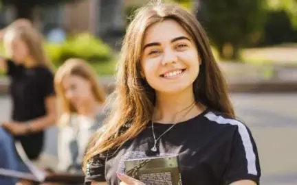 Young person celebrating personal and academic progress