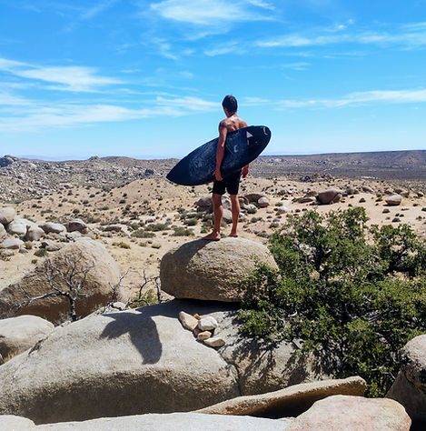 Desert Hero with surfboard