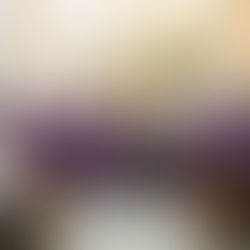 Clergy in purple vestments pose with a woman beside an altar adorned with flowers and religious artwork. Text on wall reads "Aquí que soy tu madre".