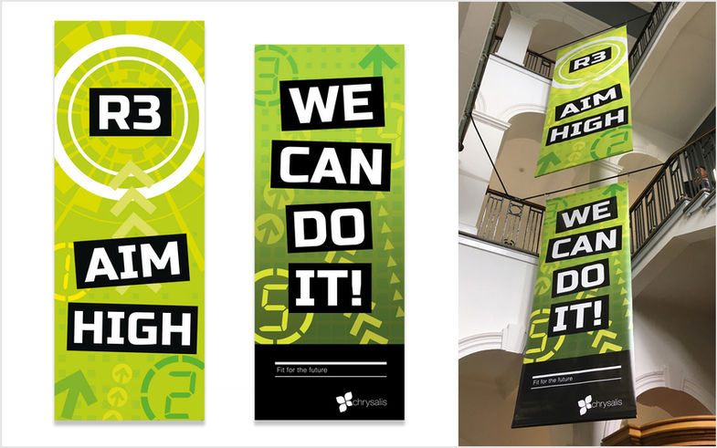 ‘Aim high – we can do it’ large hanging banners in RPMI Darlington foyer urge employees to complete programme milestone