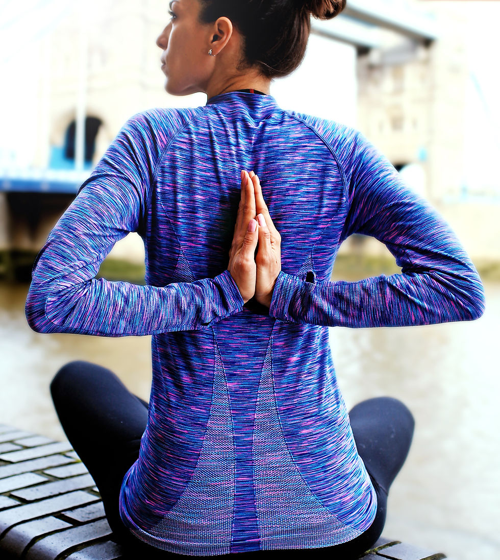 Yoga therapist demonstrating posture and movement patterns to reduce back pain during golf.