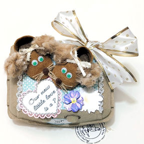 Baby reveal egg gift carton topped with felt mouse booties featuring fuzzy ears, whiskers, and a large decorative bow