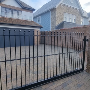 Automated steel sliding gate with Roger Technology motor and GSM intercom installed at a residential property in Canford Cliffs