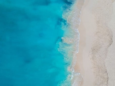 Overview of Grace Bay, Turks & Caicos. White sands, emerald seas, and a spot for you? FreeTravelQuote.com #ibookigo #traveldeals #travelgoals #tripideas #summervaycay #cruisedeals #BOGO #cruises #sahm