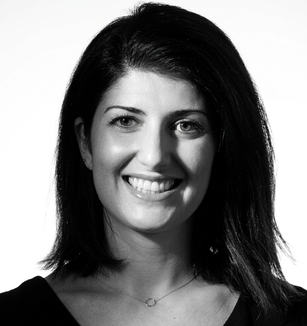 Black & white studio portrait.