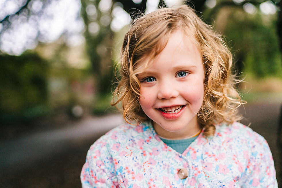 Little girl smiling in Saint Anne's Park