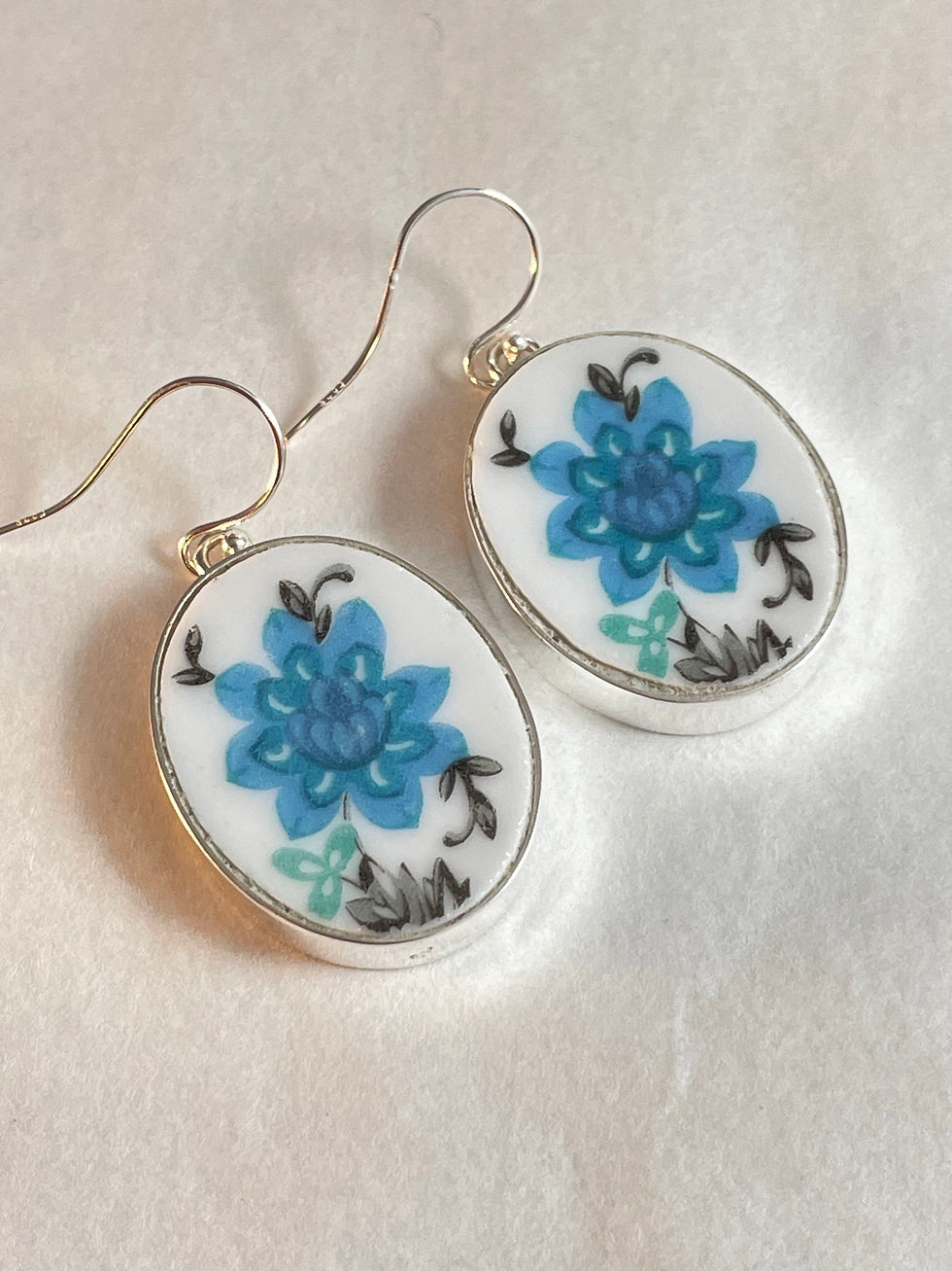 Thumbnail: large blue flower on oval drop earrings