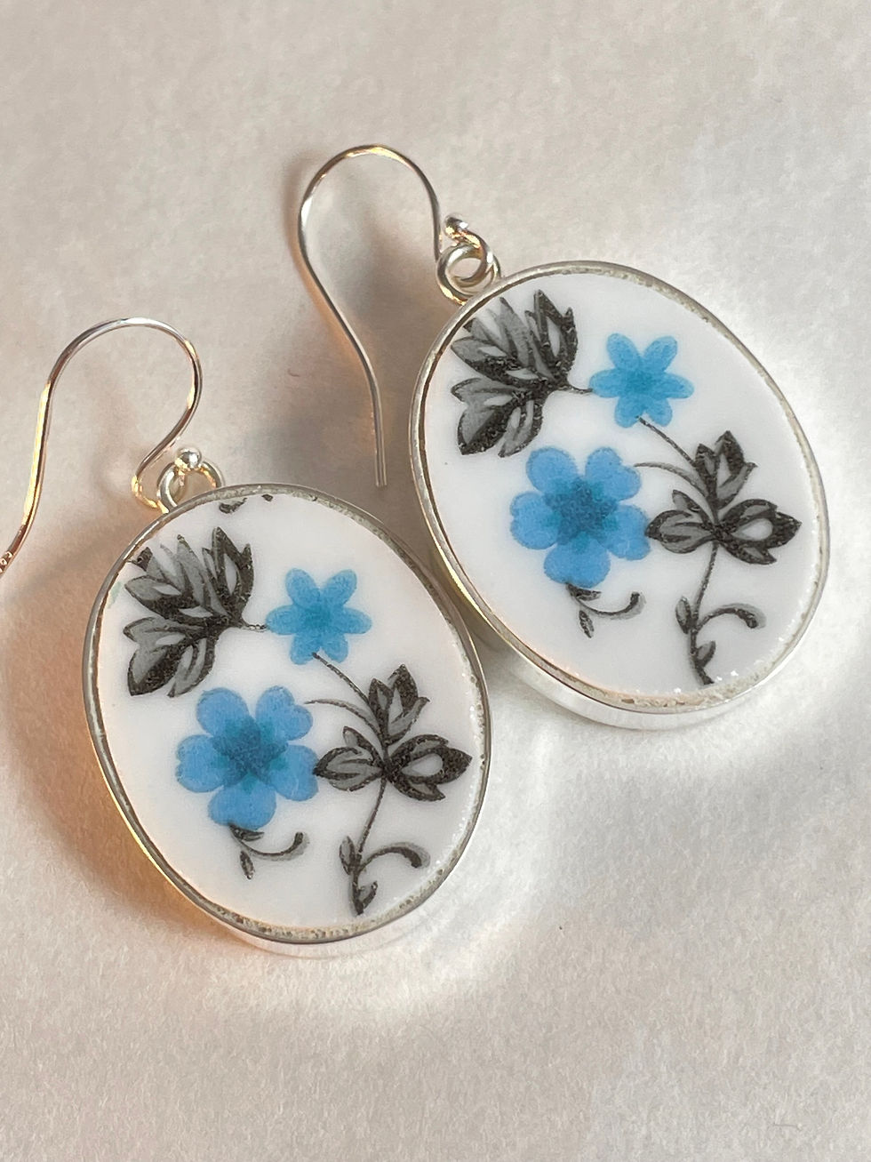 Thumbnail: oval drop earrings with light blue flowers