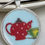 Thumbnail: round pendant with red tea pot and green tea cup