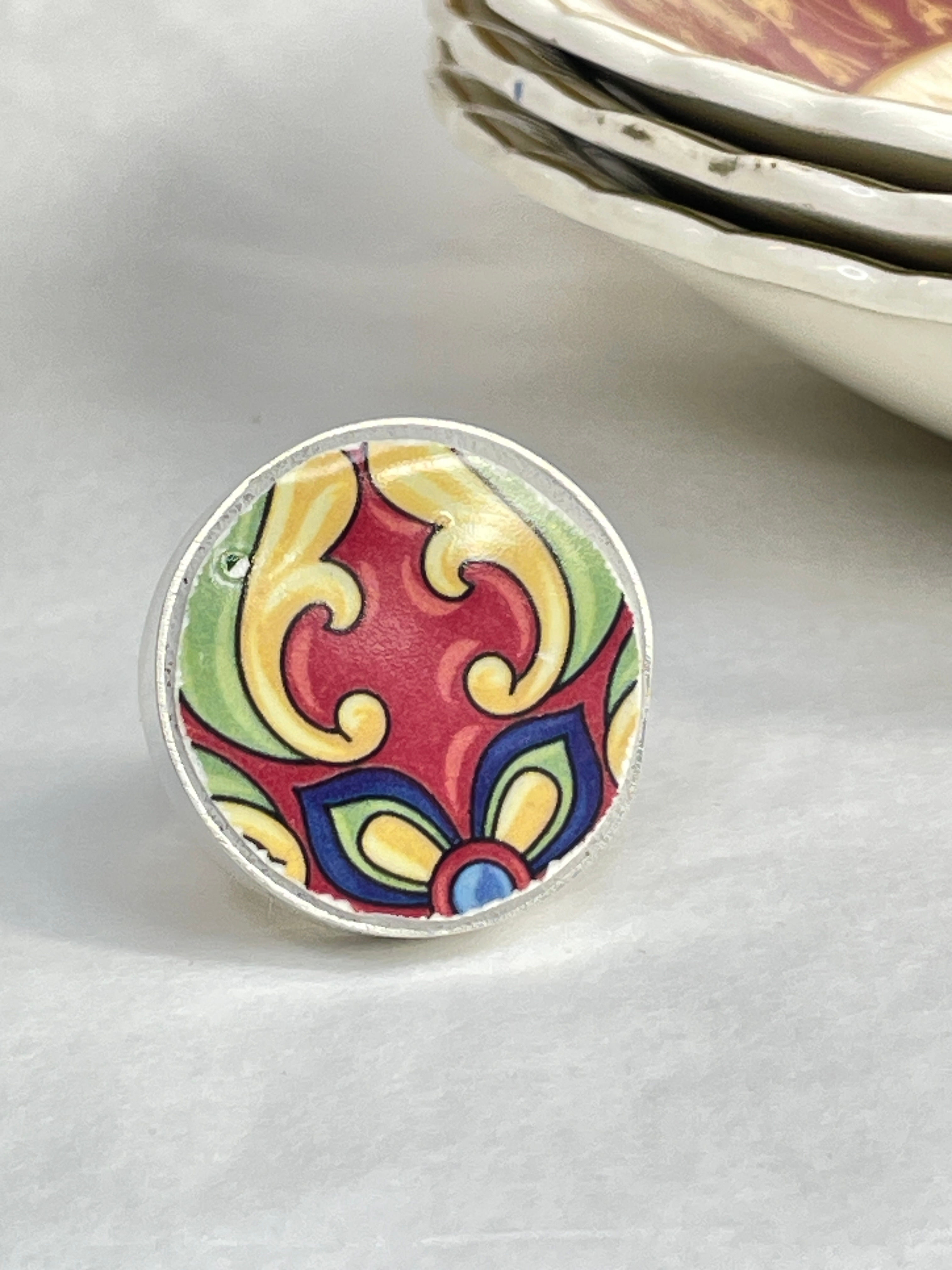 Mexican Talavera tile in crimson and lime green ring