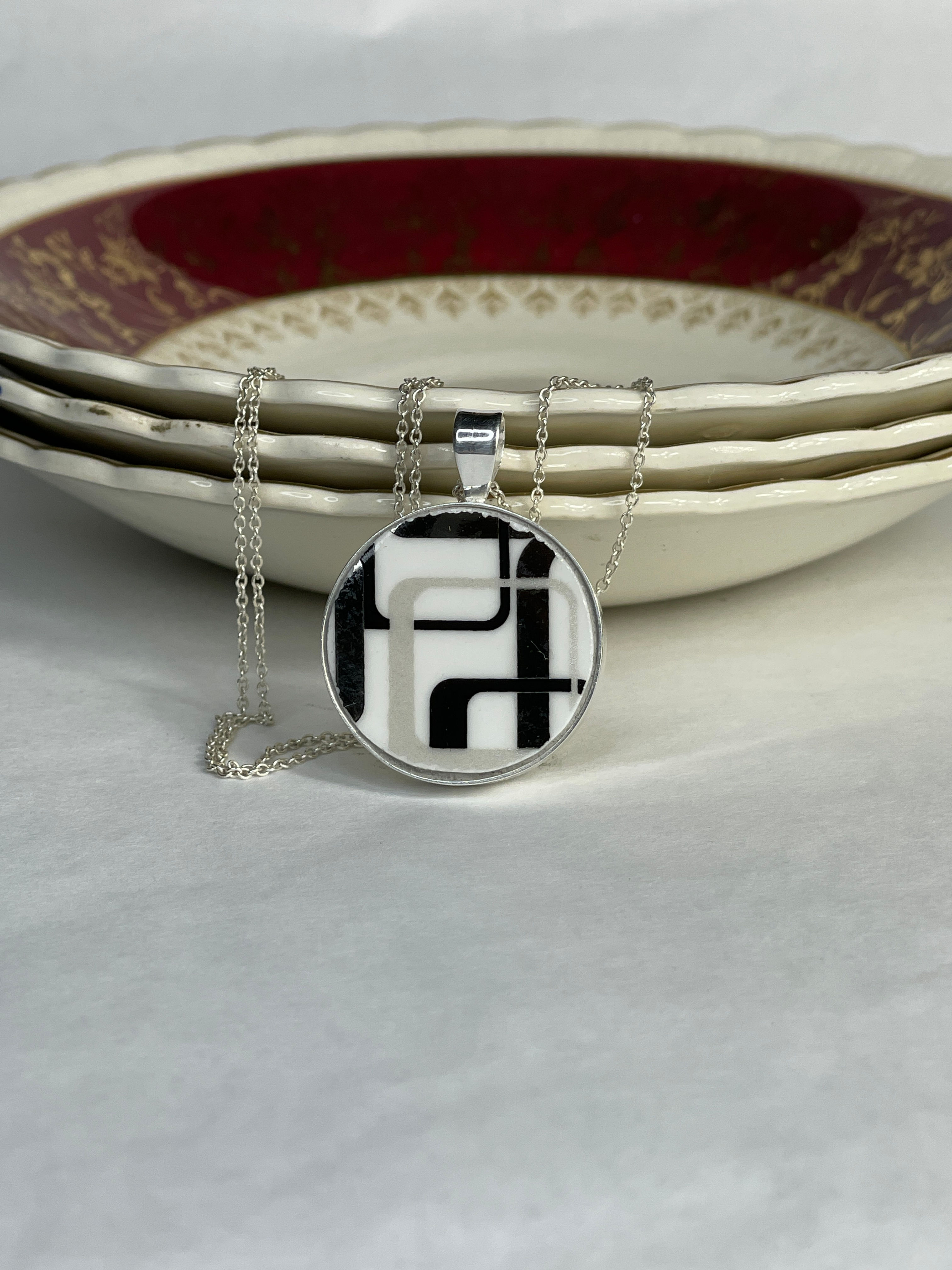 large round pendant with geometric pattern from the 1970's
