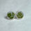 Thumbnail: stud earrings with small green flowers on a white background