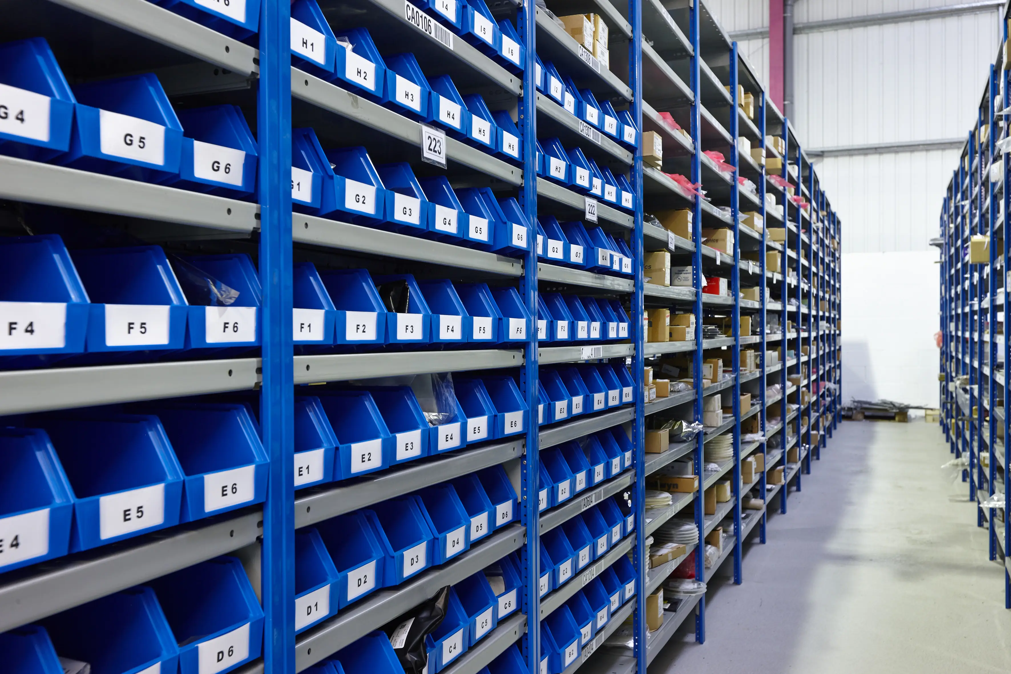 Blue storage pots on warehouse racking