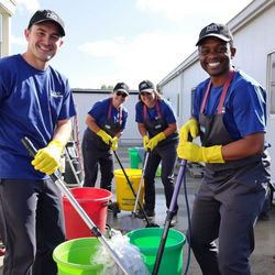 cleaning crew cleaning and smiling