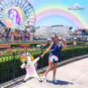 Girl and unicorn at a theme park