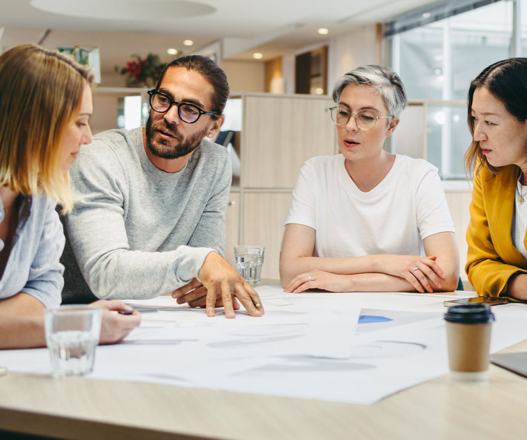 A leadership team discusses how to handle a complex HR workplace labor decision