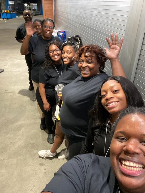 volunteers lined up in a group selfie
