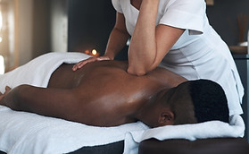 Working out the tension. Shot of a young man getting a back massage at a spa