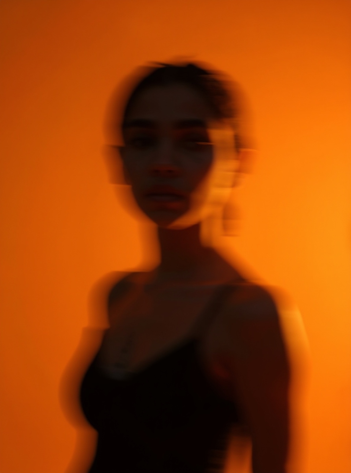 Warm motion portrait with reflected faces