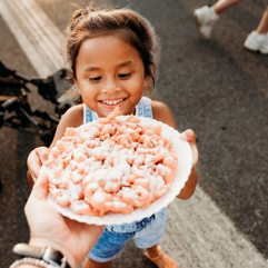 A child enjoying some food from the Delaware State Fair.