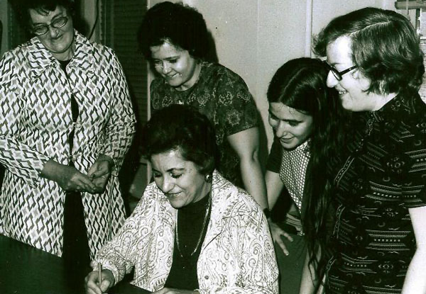 KenCCID founding members (1974) signing KenCCID’s Incorporation.
Seated is Mrs. Ruth Frank; Standing from left to right are Teresa Vanderwoude, Barbara Bortell, Ellie Farsteinberg and Joan Hecht