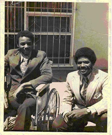 Brad Lomax and his personal caregiver Chuck Jackson.
