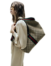 Women holding Gucci Tote Bag