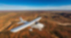 A Cessna 172 aircraft flying over the Australian outback representing Class 2 Private Pilot Licence privileges.