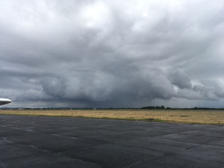Dark shower clouds beyond the apron at Teesside Airport.