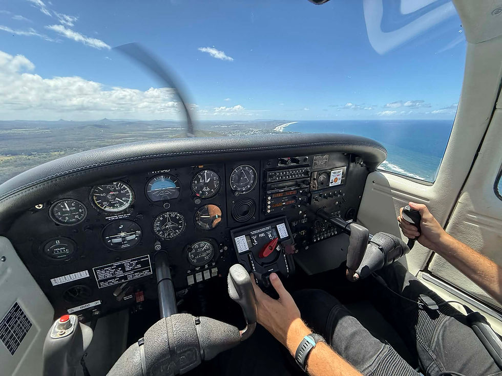 Piper Tomahawk controls and flight instruments during a coastal flight.