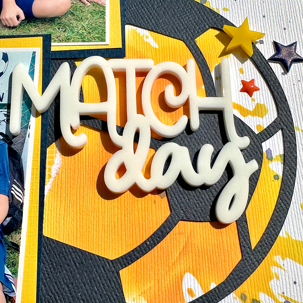 Football, soccer Scrapbook page with white persex title 'Match day' in white over orange and black graphics, stars, and photo corners on grass background