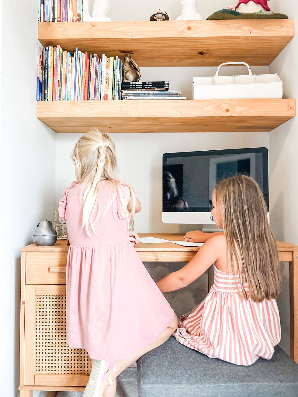 Girls at a computer desk