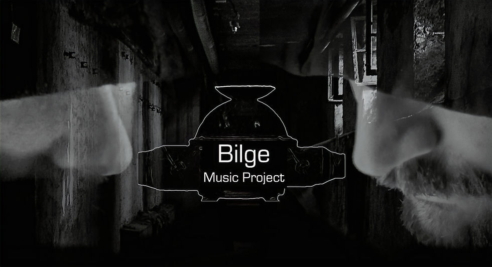 Picture is a moody shot showing Eros & GlassTear's half obscured faces with a deserted industrial looking backdrop. The band logo of a Bilge pump with the words Bilge Music Project is placed in the centre of the picture