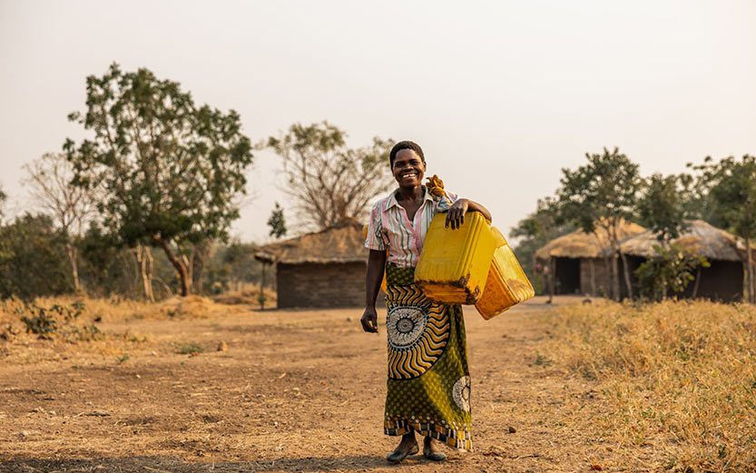 Young african woman with fresh water.