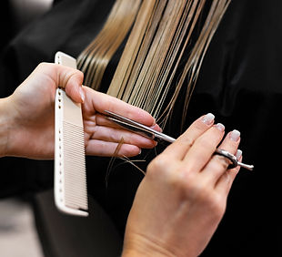 woman-getting-her-hair-cut-beauty-salon.jpg