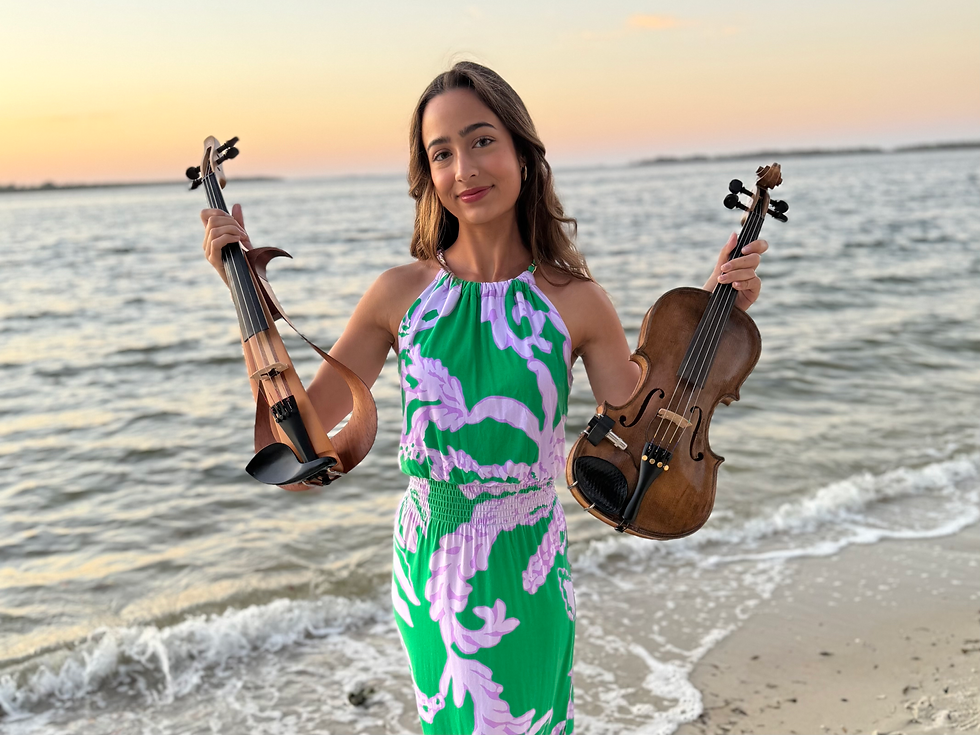 Violinist holding an electric violin and a acoustic violin