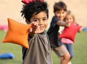 kids ages 10 yrs old, throwing bean bags, having fun.jpg