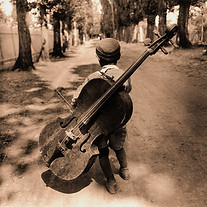 gypsy-boy-with-cello-lake-balaton-hungar