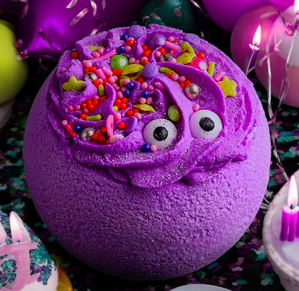 LARGE ROUND PURPLE BATH BOMB TOPPED WITH BUBBLE FROSTING AND BRIGHT SPRINKLES