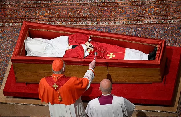 The body of Pope Francis lies in a casket before it's sealed, at St. Peter's Basilica, ahead of his funeral at the Vatican, April 25, 2025