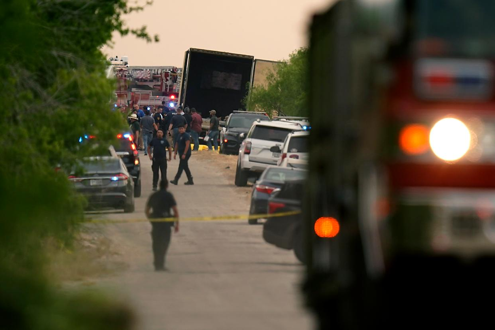 Body bags lie at the scene where a tractor trailer with multiple dead bodies was discovered, Monday, June 27, 2022, in San Antonio. (AP Photo/Eric Gay,File)