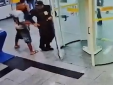 Brazilian boy, 16, disarms and shoots bank's security guard, 47, in the neck before hiding behind his mother