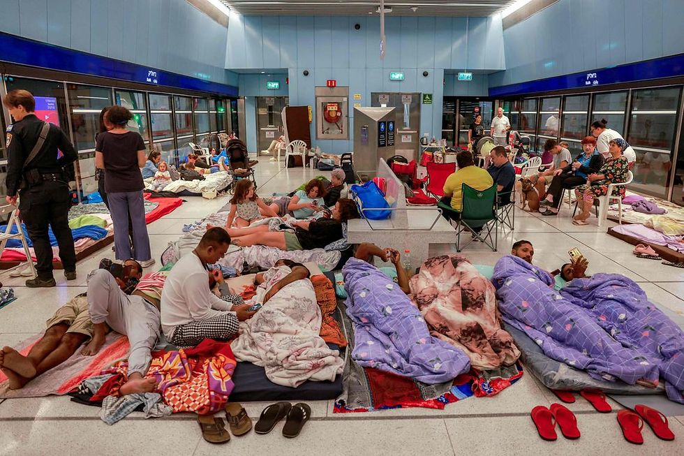 People rest inside an underground train station used as a shelter amid rounds of missile attacks from Iran to Israel in recent days, in Ramat Gan, Israel June 17, 2025.