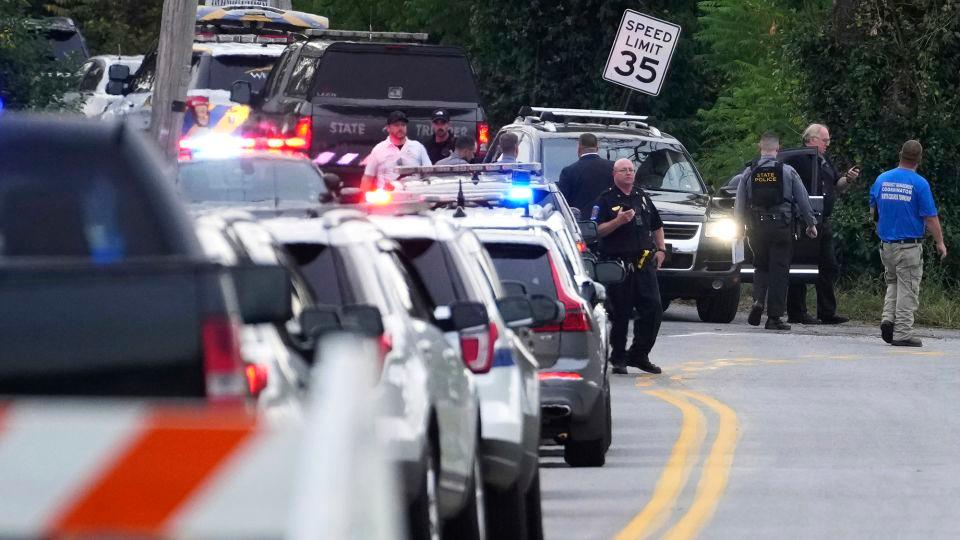 A long line of law enforcement vehicles are staged on the scene in North Codorus, Pennsylvania, where five people were shot