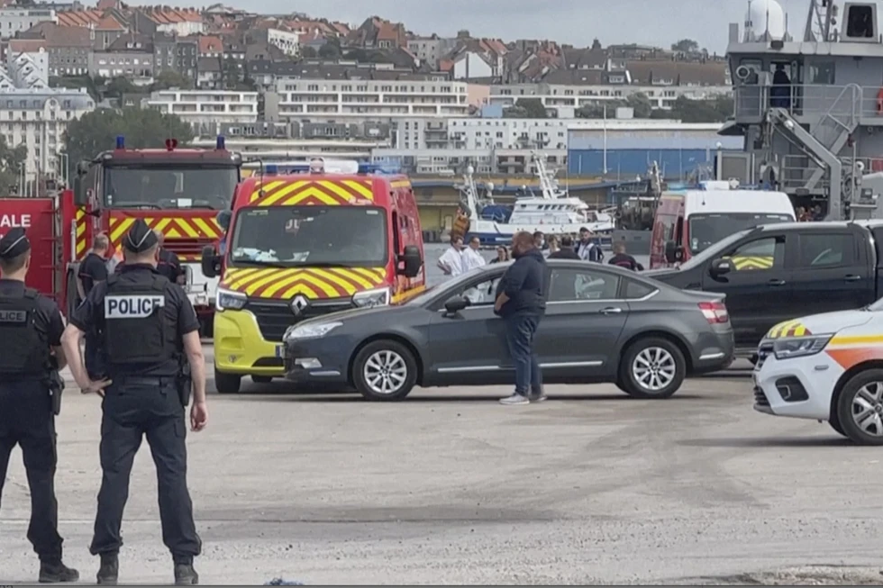 emergency services at the port of Boulogne-Sur-Mer, France, Tuesday, Sept. 3, 2024, after a boat thought to be carrying migrants ripped apart attempting to cross the English Channel. 