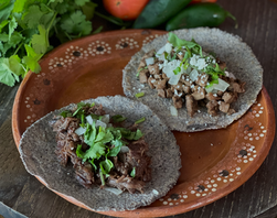 Top sirloin tacos on blue corn tortillas